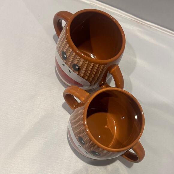 Pair of brown Galerie two-handle ceramic sock monkey mugs - Picture 2 of 4